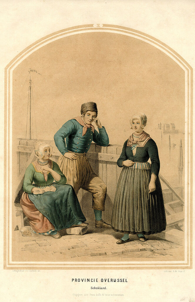 Man en vrouwen in Schokker klederdracht