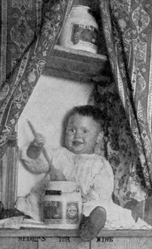 Baby eating Heinz apple butter